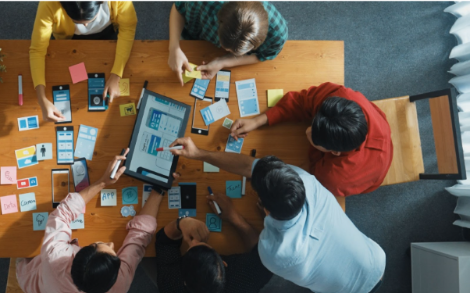 Stakeholders sitting around a table to plan a design